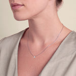 Load image into Gallery viewer, Model wearing the Round Brilliant Rubover Diamond Pendant, High Set on a fine chain