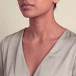 Load image into Gallery viewer, Model wearing the Marquise Style Round Diamond Pendant on a fine chain
