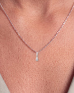 Load image into Gallery viewer, Pear Shaped Diamond Pendant worn – close-up on the collarbone