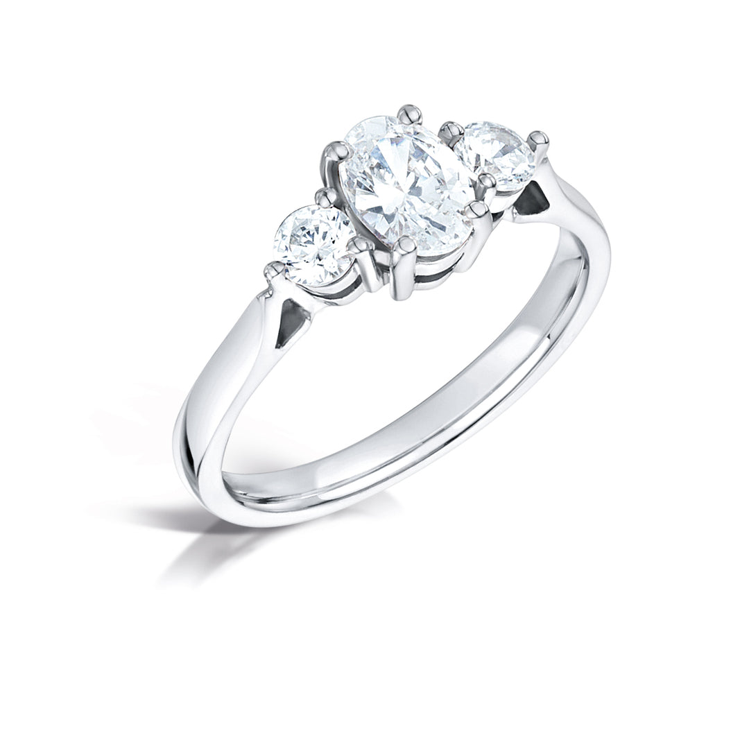 Three Stone Oval And Round Brilliant Cut Diamond Trilogy Ring.