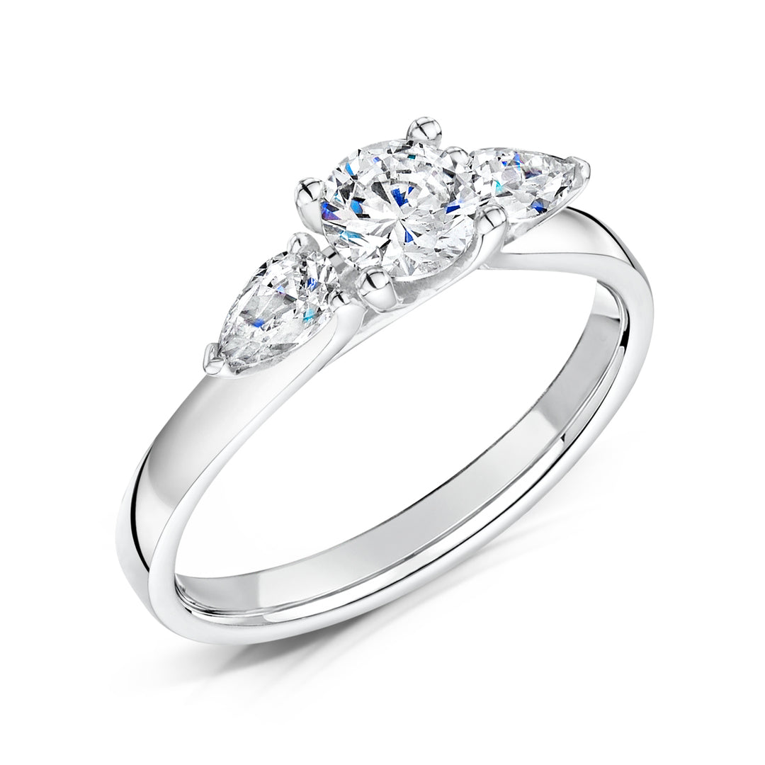 Three Stone Round Brilliant And Pear Shape Diamond Ring