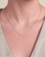 Load image into Gallery viewer, Three Stone Diamond Drop Pendant with Split Bail worn – close-up on the collarbone