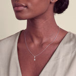 Load image into Gallery viewer, Model wearing the Six Claw Round Diamond Pendant on a fine chain