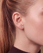 Load image into Gallery viewer, Martini Style 4 Claw Diamond Stud Earrings worn – close-up on the ear