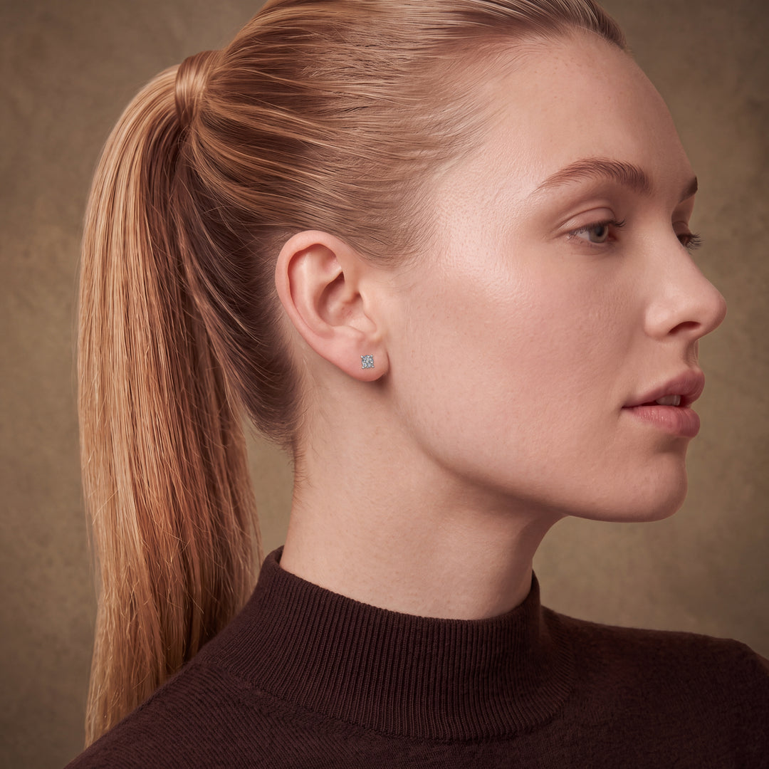 Model wearing the Martini Style 4 Claw Diamond Stud Earrings – side profile