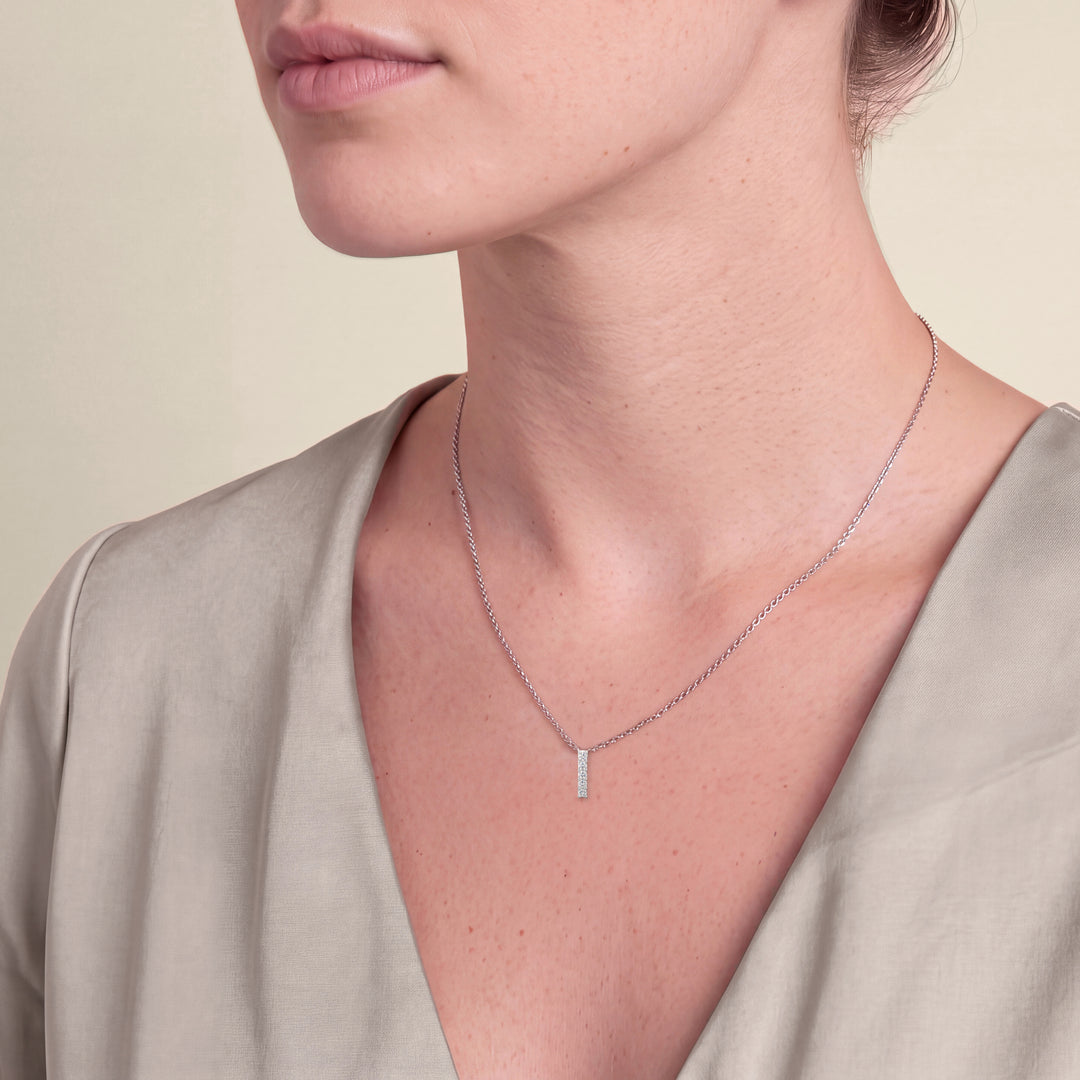 Model wearing the Round Five Stone Diamond Drop Pendant on a fine chain