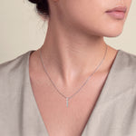 Load image into Gallery viewer, Model wearing the Five Stone Round Diamond Drop Pendant on a fine chain