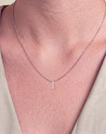 Load image into Gallery viewer, Three Stone Diamond Pendant worn – close-up on the collarbone