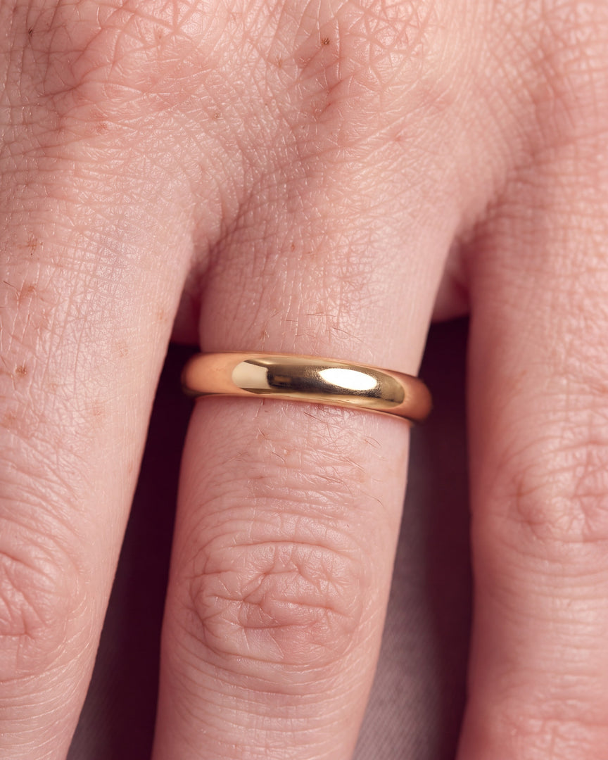 3mm Traditional Court Wedding Band worn, close-up on the ring finger
