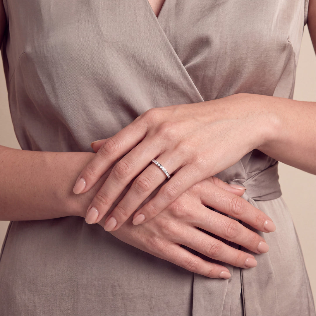 Model wearing the 2.0mm Grain Half Set Diamond Band on her ring finger