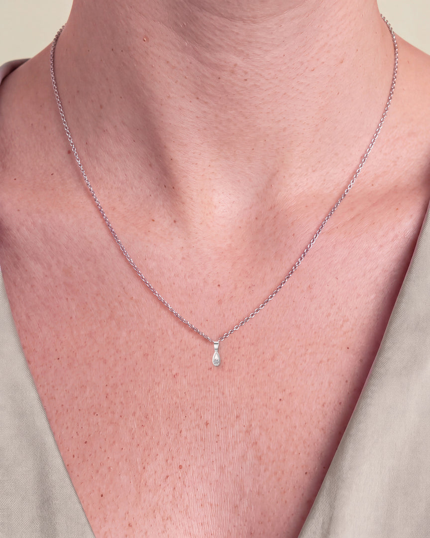 Pear Shaped Style Round Diamond Pendant worn – close-up on the collarbone