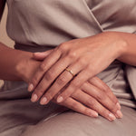 Load image into Gallery viewer, Model wearing the 2mm Traditional Court Wedding Band in 9ct Yellow Gold on her ring finger