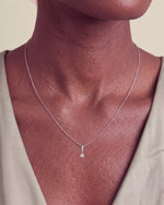 Load image into Gallery viewer, Six Claw Round Diamond Pendant worn – close-up on the collarbone