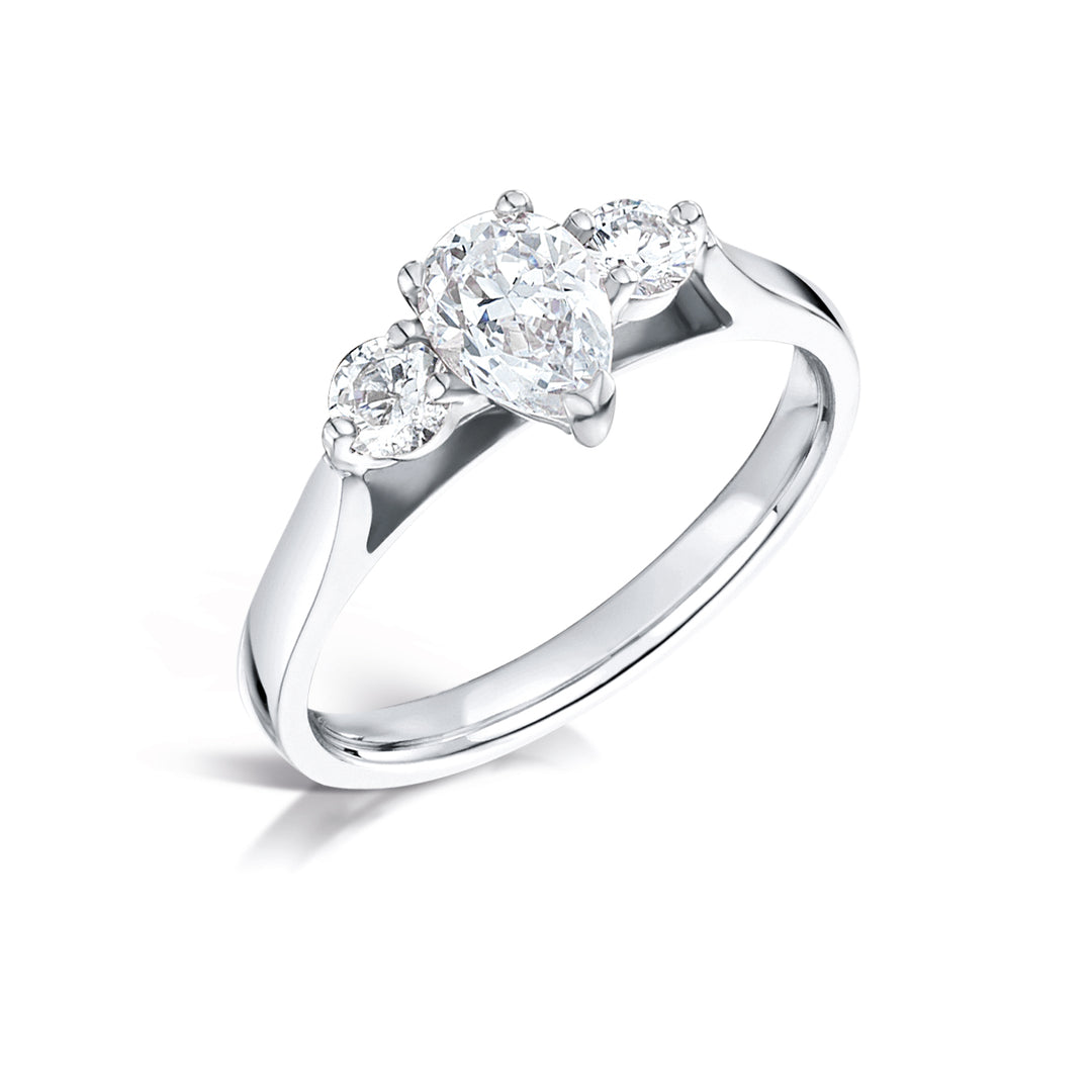 Three Stone Pear Shaped And Round Brilliant Diamond Trilogy Ring.